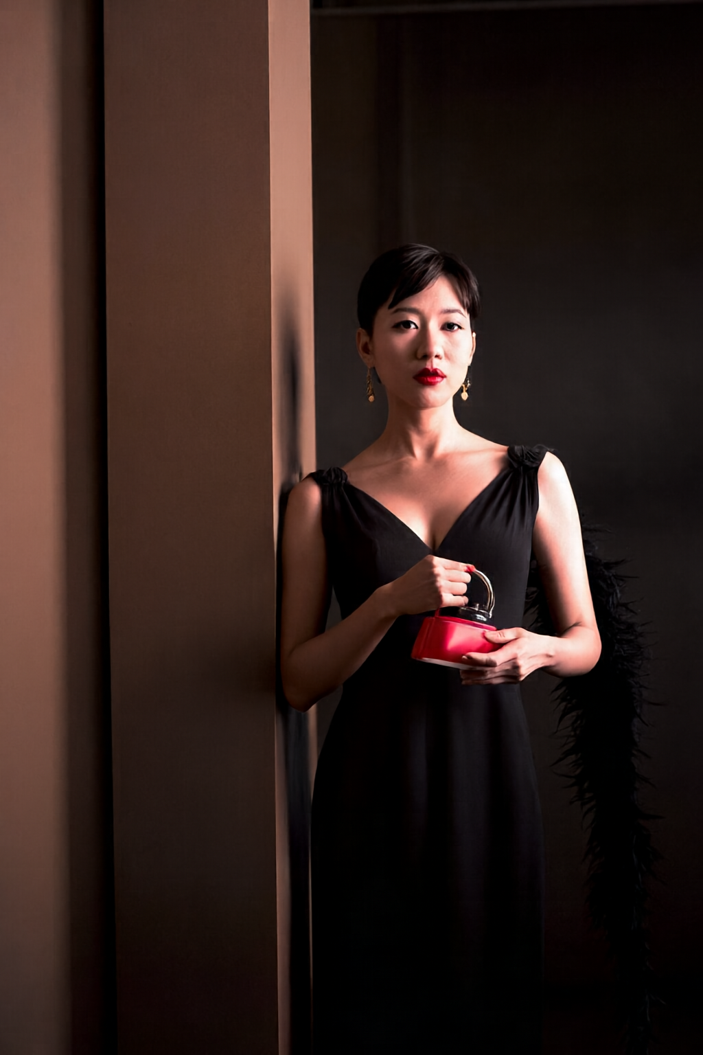Woman holding a red perfume bottle