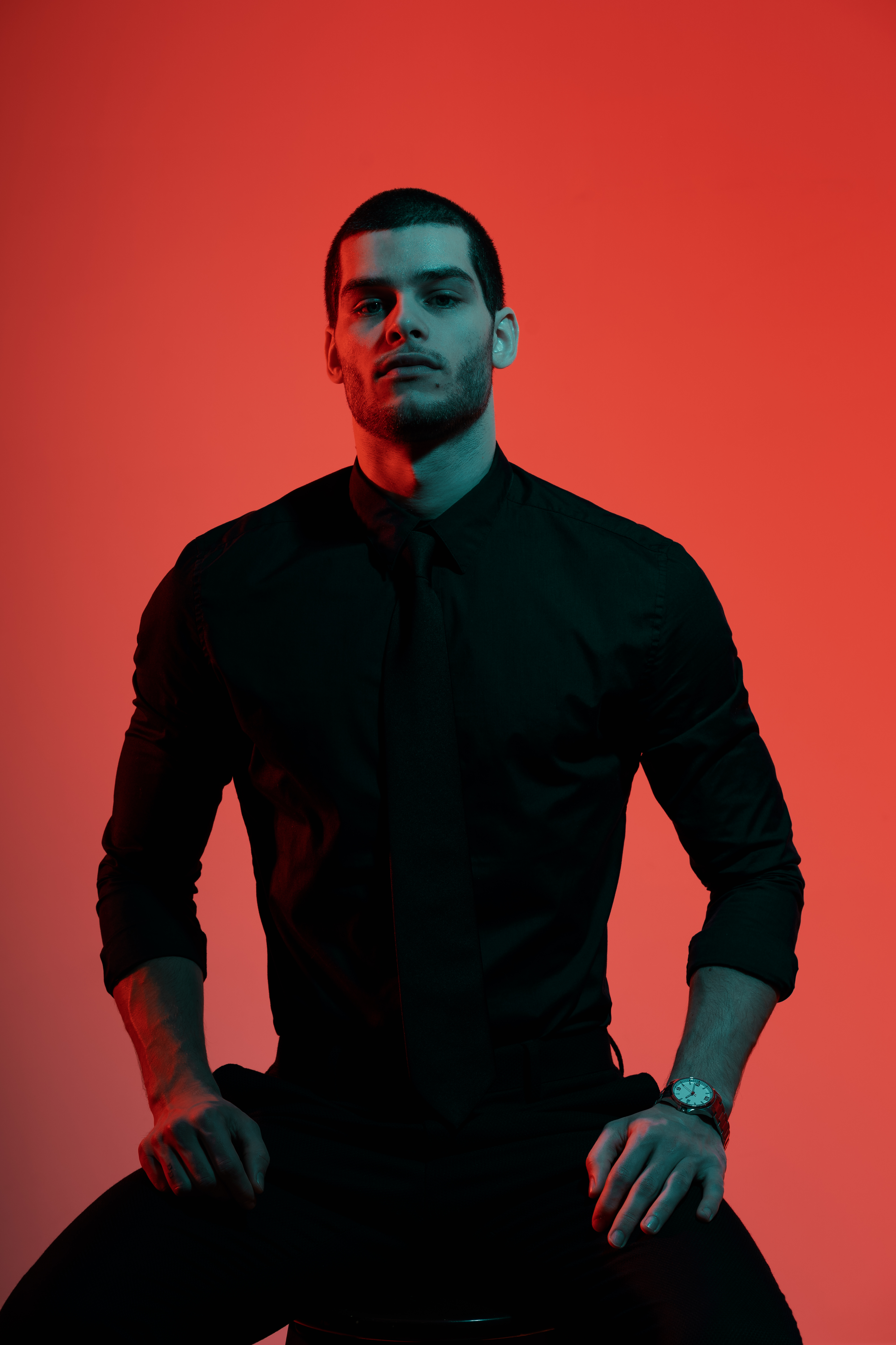 portrait-young-confident-handsome-businessman-blue-red-light.jpg
